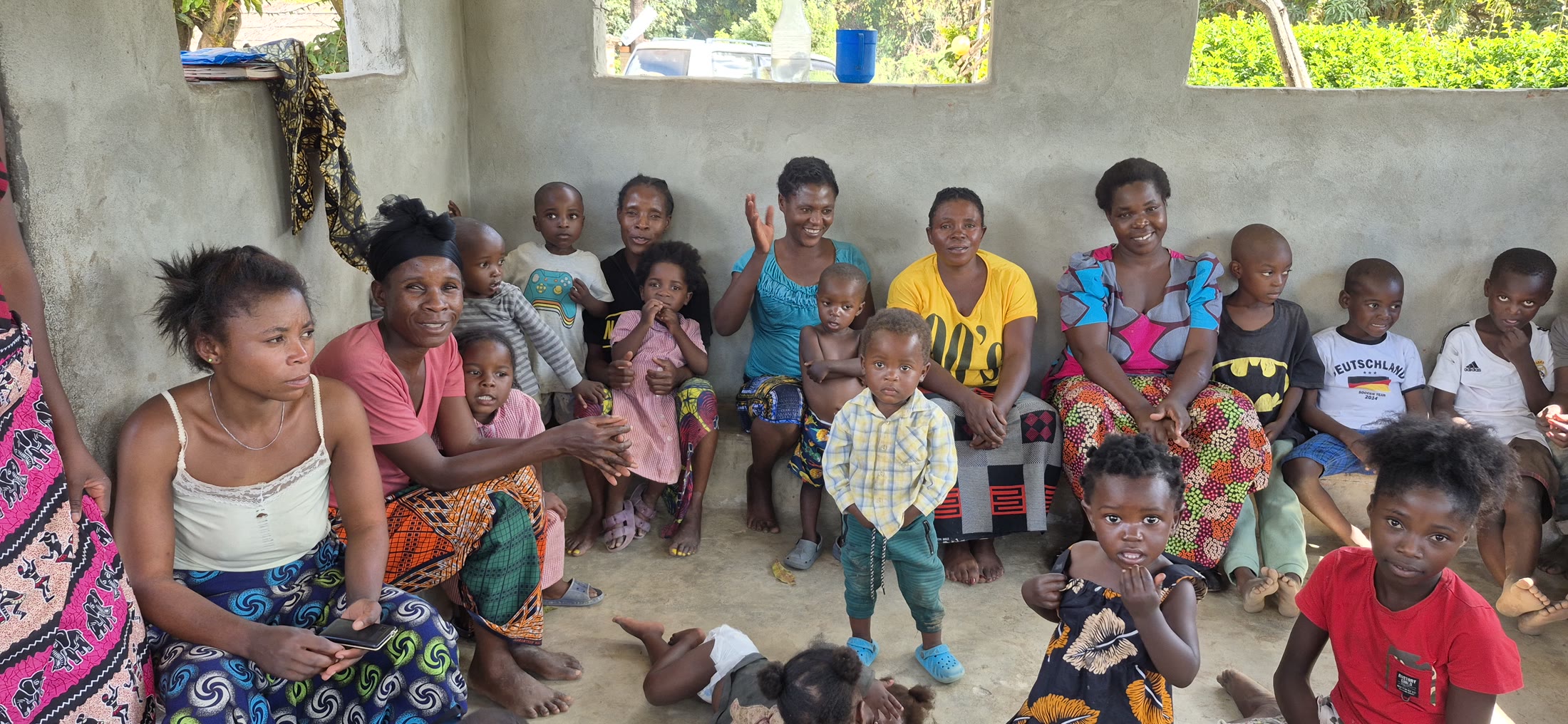 Families and children gathered inside a community building